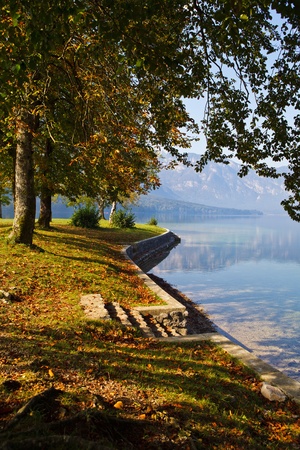 Autumn time at lake in valley in Slovenian Alps. の写真素材