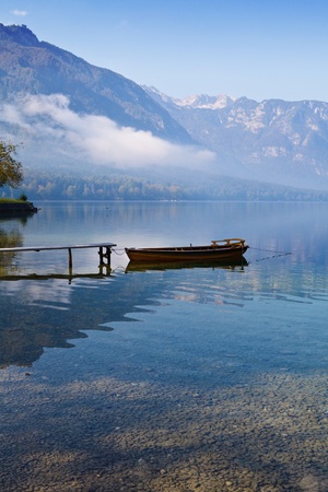 Autumn time at lake in valley in Slovenian Alps. の写真素材