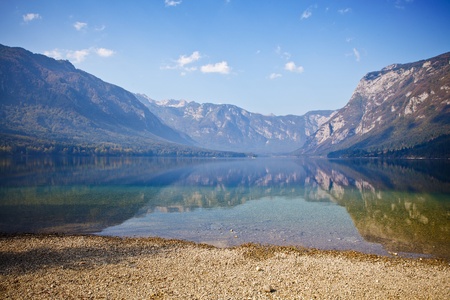 Autumn time at lake in valley in Slovenian Alps. の写真素材