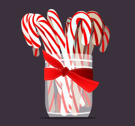 Christmas sweet candy design. Sweet caramel. Vector illustration of red and white caramel candies in a transparent jar tied with a red ribbon.のイラスト素材