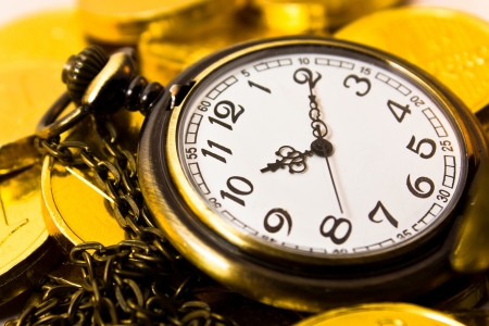 vintage chain watch on gold coinの写真素材