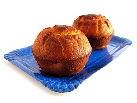 Two golden pastries isolated over white background
