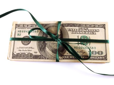 one hundred dollar bills wrapped with a green ribbonの写真素材