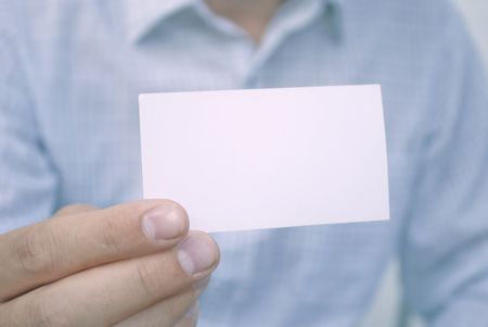 closeup of blank card in handの写真素材