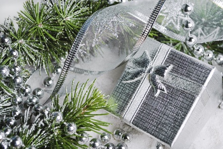 Silver gift box and christmas decoration in snow