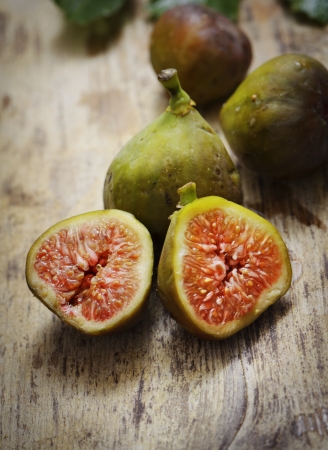 Sliced fig on rustic wooden tableの写真素材
