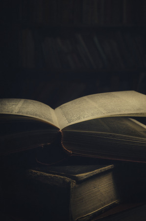 Antique book in the dark with texture addedの写真素材