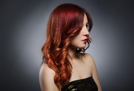 Beautiful woman with fashionable red hairstyleの写真素材