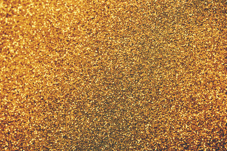 Golden glitter textured for christmas and new year celebration party.の写真素材