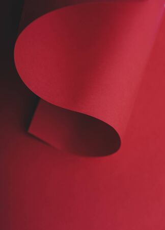 Abstract red geometry creative shape background. Modern and trendy minimal paper composition. Flat lay minimalist layout.の写真素材