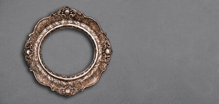 Vintage luxury golden frame with ornate baroque decoration on rustic texturedの写真素材