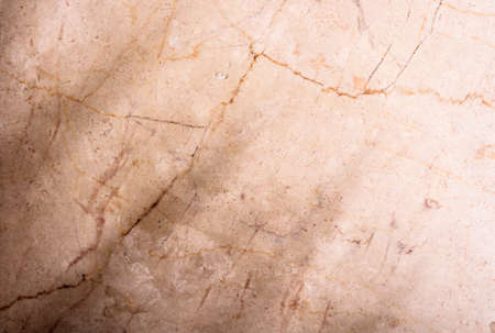 Luxury beige marble background with tropical palm leaf shadow. Top view. Natural organic material with sunshine light. Summer neutral tone layout.の写真素材