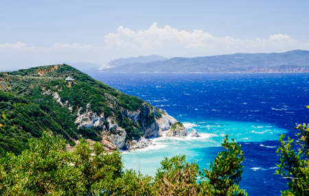 Mediterranean hidden places at Kastro, Skiathos island, Greece. Beautiful vivid panorama view of blue aegean sea coast from wild cliff.  Summer holiday vacation tour.の写真素材