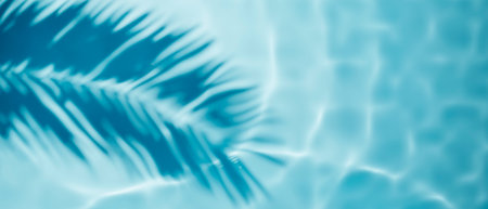 Aqua waves and coconut palm shadow on blue background. Water pool texture top view.Tropical summer mockup design. Luxury travel holiday.の写真素材