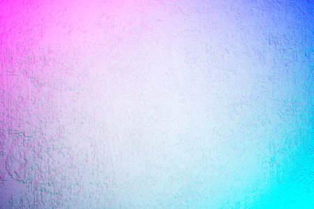 White textured concrete wall with laser neon lights. Abstract iridescent grunge background with holographic colors.の写真素材