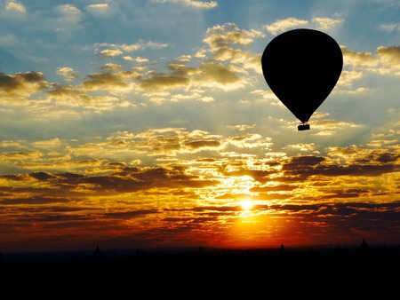 Sunrise in a hot air balloon over Baganの写真素材