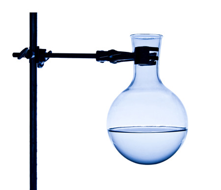 Chemist fixes flask on support isolated on whiteの写真素材