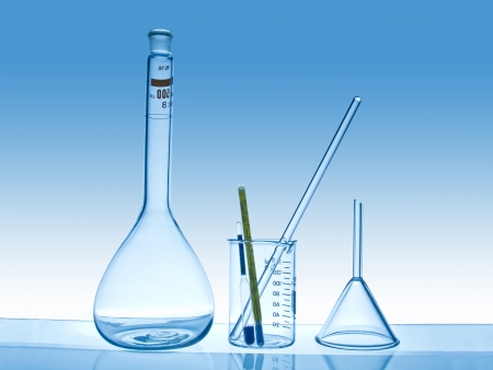chemical laboratory glassware on blue gradient backgroundの写真素材