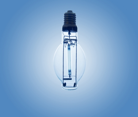 Closer to light bulb on blue background and white.の写真素材