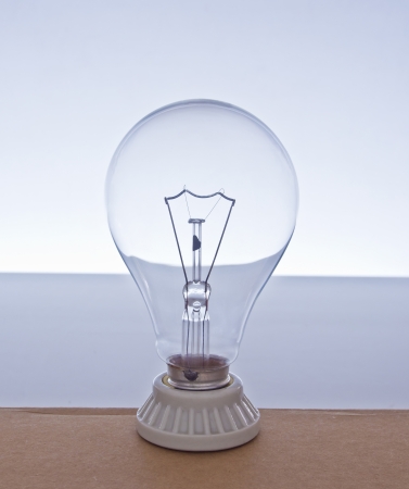 close-up incandescent Light bulb blue gradient backgroundの写真素材