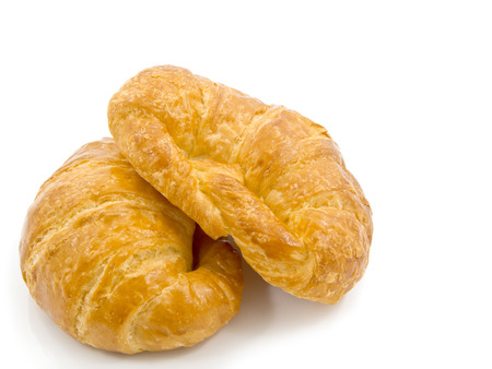 fresh french croissant on white backgroundの写真素材