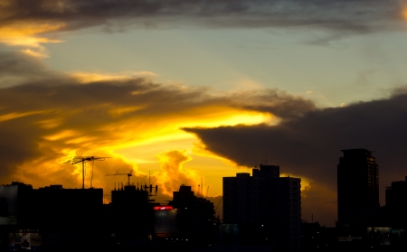 colorful cloudy sky on sunset time with cityscapeの写真素材