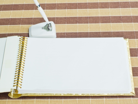 note paper and pen on cloth backgroundの写真素材