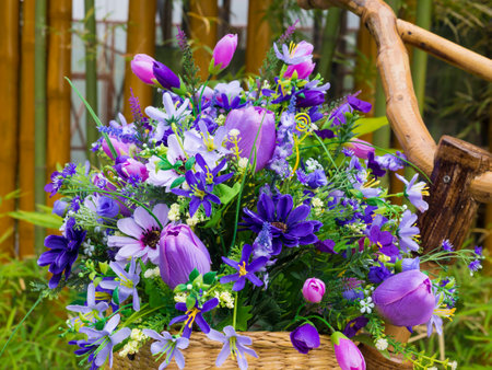 colorful artificial flowers on basketの写真素材