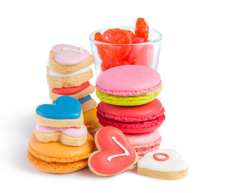colorful macaroons and biscuits on white の写真素材