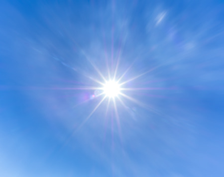 12mm lens flare in the afternoon on blue sky 