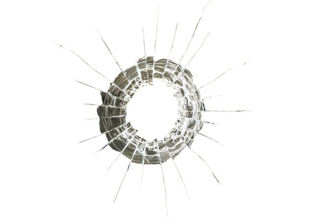 glass cracked by bullet impacts, isolated on whiteの写真素材