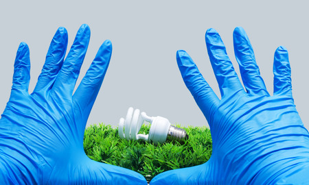 compact fluorescence on artificial green grassの写真素材