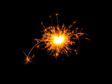 fire in cracker explodes on black backgroundの写真素材