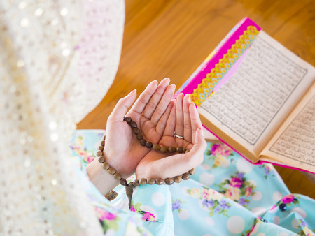 young muslim woman praying for Allah, muslim Godの写真素材