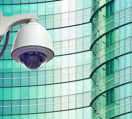 cctv installed outdoor in front of the building on the colorful windows
