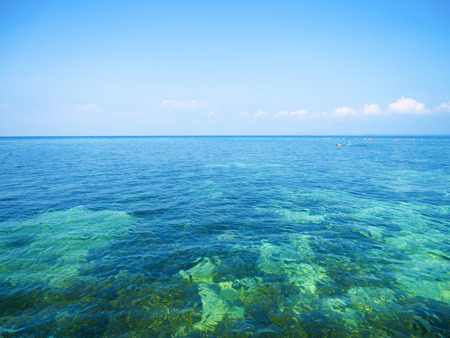 beautiful seascape and blue sky, showing tropical coral reef as seen from from the skyの写真素材