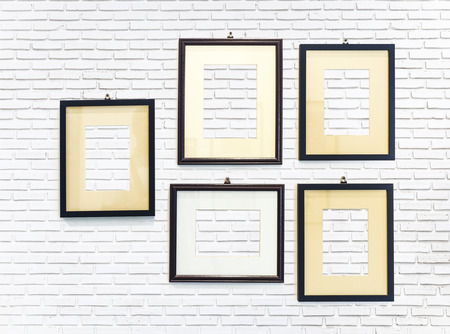 photo frame on white brick wall texture backgroundの写真素材