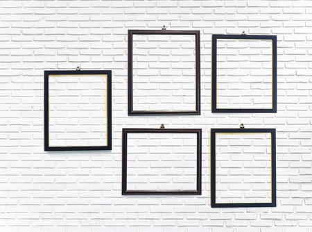 photo frame on white brick wall texture backgroundの写真素材