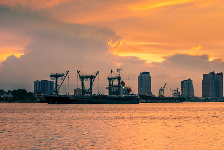 cargo transport activity on shipping management in the colorful sunset backgroundの写真素材