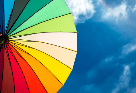 colorful umbrella segments on blue sky backgroundの写真素材