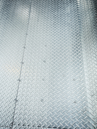 diamond shape on stainless steel texture backgroundの写真素材