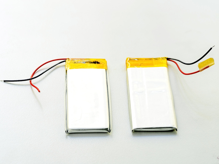 stack of used lithium-iron battery with wire, the battery removed from mobile phone