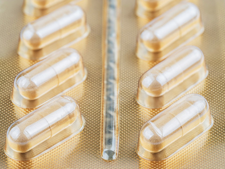 herbal medicine powder contained in capsules on white background