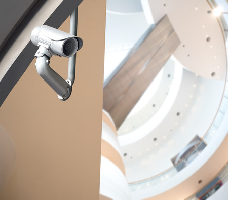 Security CCTV camera or surveillance system in modern office buildingの写真素材