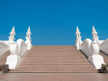 step stair leading up to blue sky backgroundの写真素材