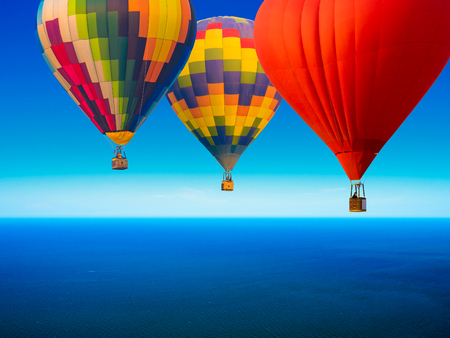 beautiful tropical seascape in the daytime with blue sky background with balloonsの写真素材