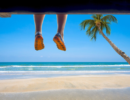 beautiful sand beach in front of ocean wave and blue skyの写真素材