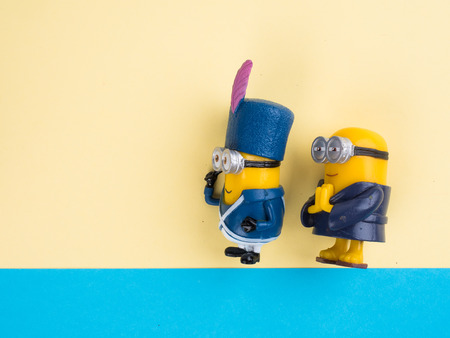 BANGKOK, THAILAND - DECEMBER 06, 2016: Minions toy figure on color background, Minion is a figure from Despicable Me and Minions(2015) produced by Illumination Entertainment for Universal Pictures.のeditorial素材