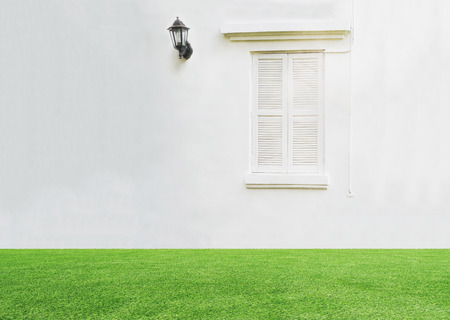 vintage window on clear white wall with electric lampの写真素材