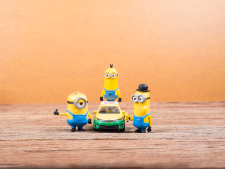 BANGKOK, THAILAND - MARCH 27, 2017: Minions toy figures on wooden background, Minion is a figure...